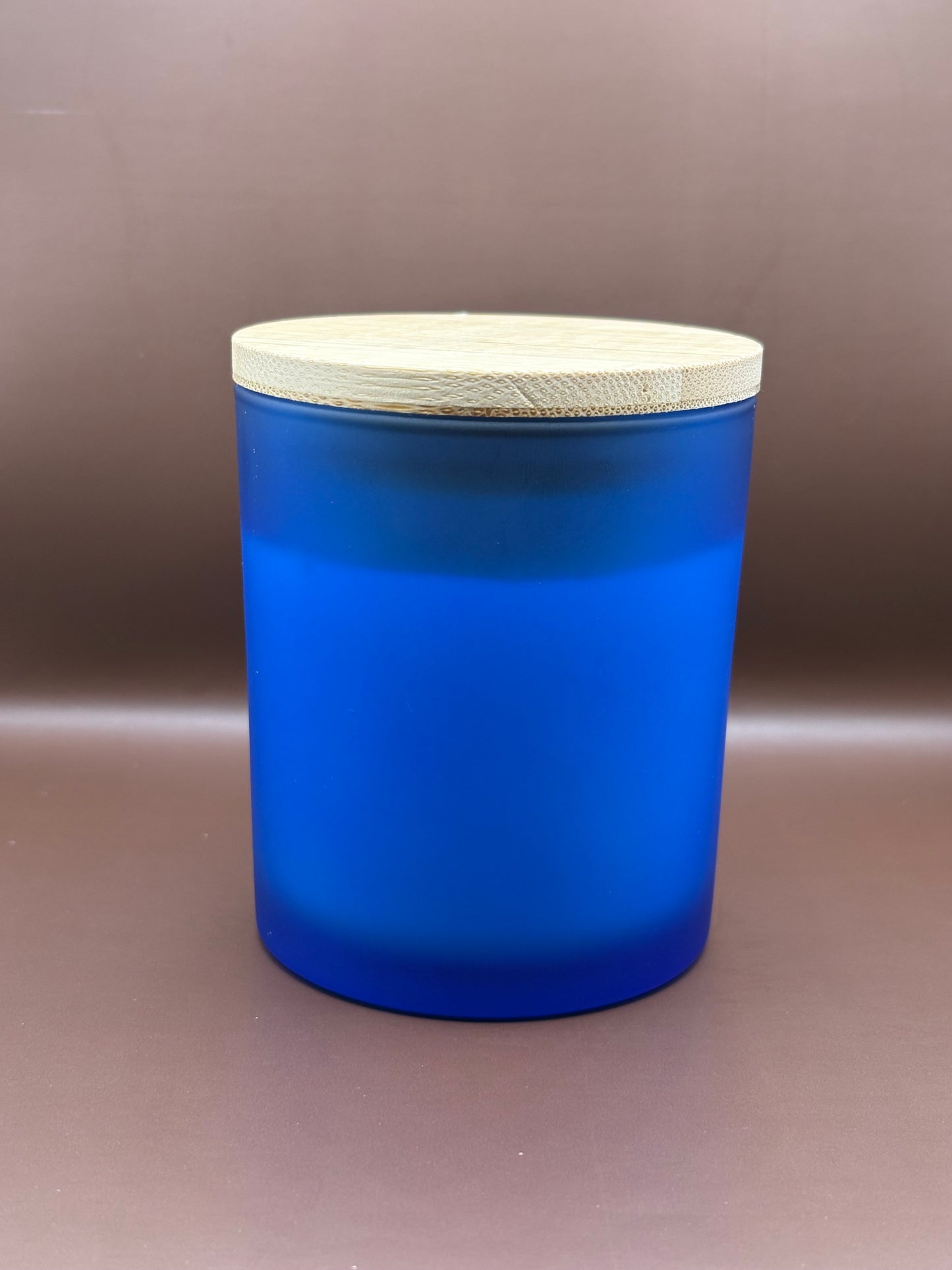 Scented 7oz Soy Wax Candles In A Frosted Blue Glass Candle Jar.
