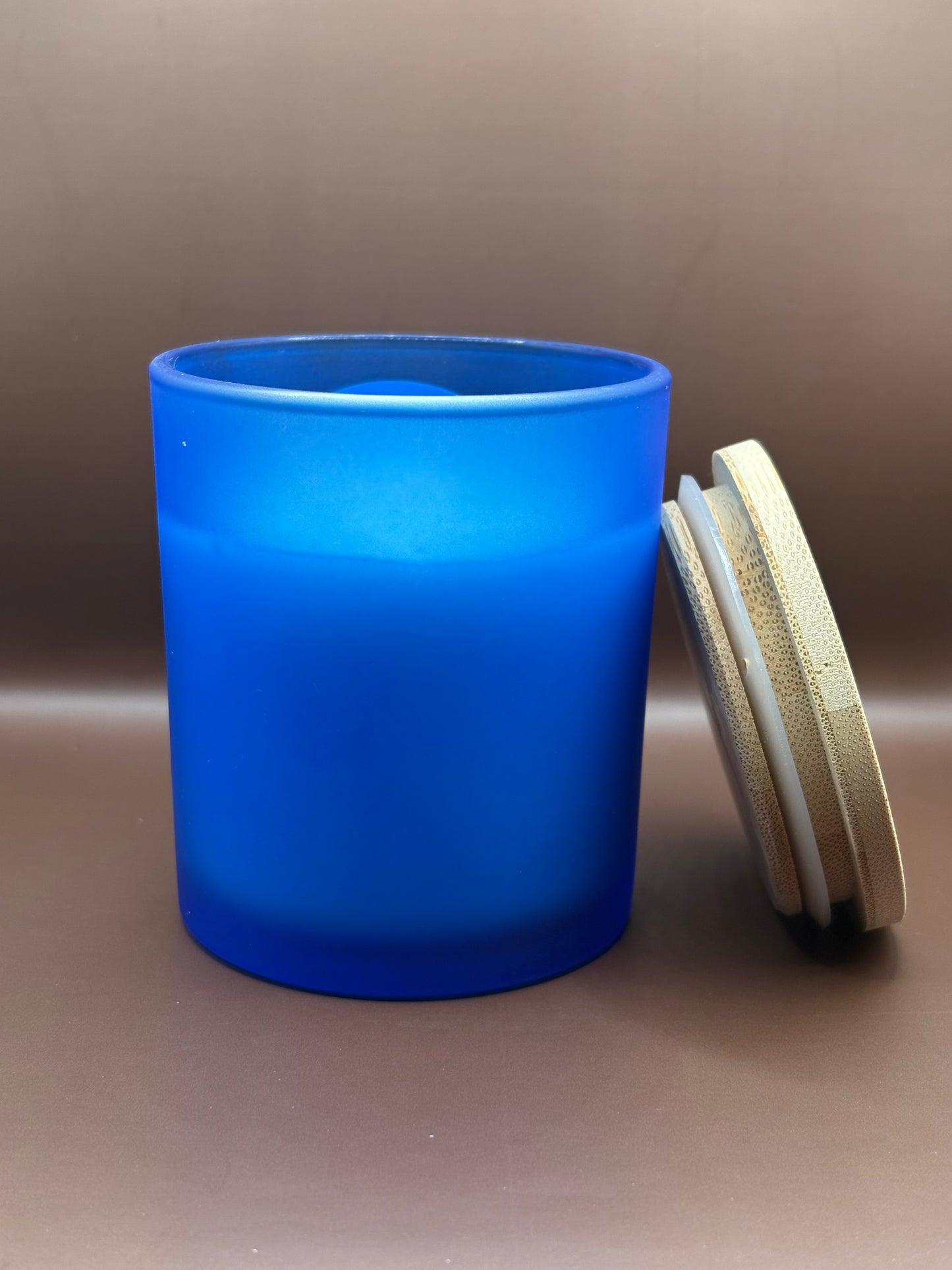 Scented 7oz Soy Wax Candles In A Frosted Blue Glass Candle Jar.