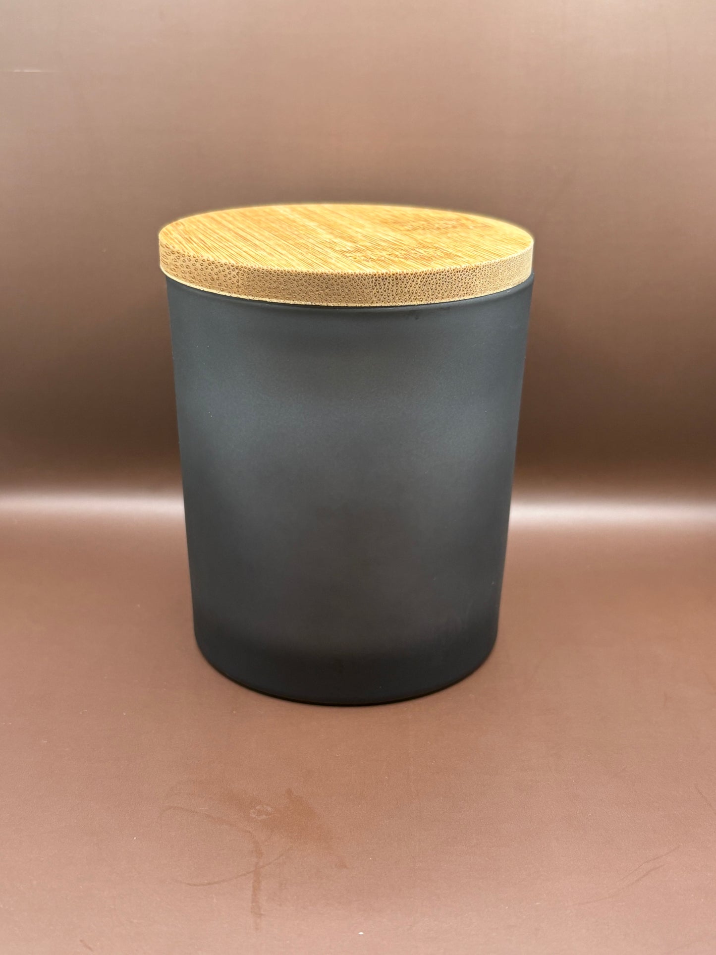Scented 7oz Soy Wax Candles In A Frosted Black Glass Candle Jar.