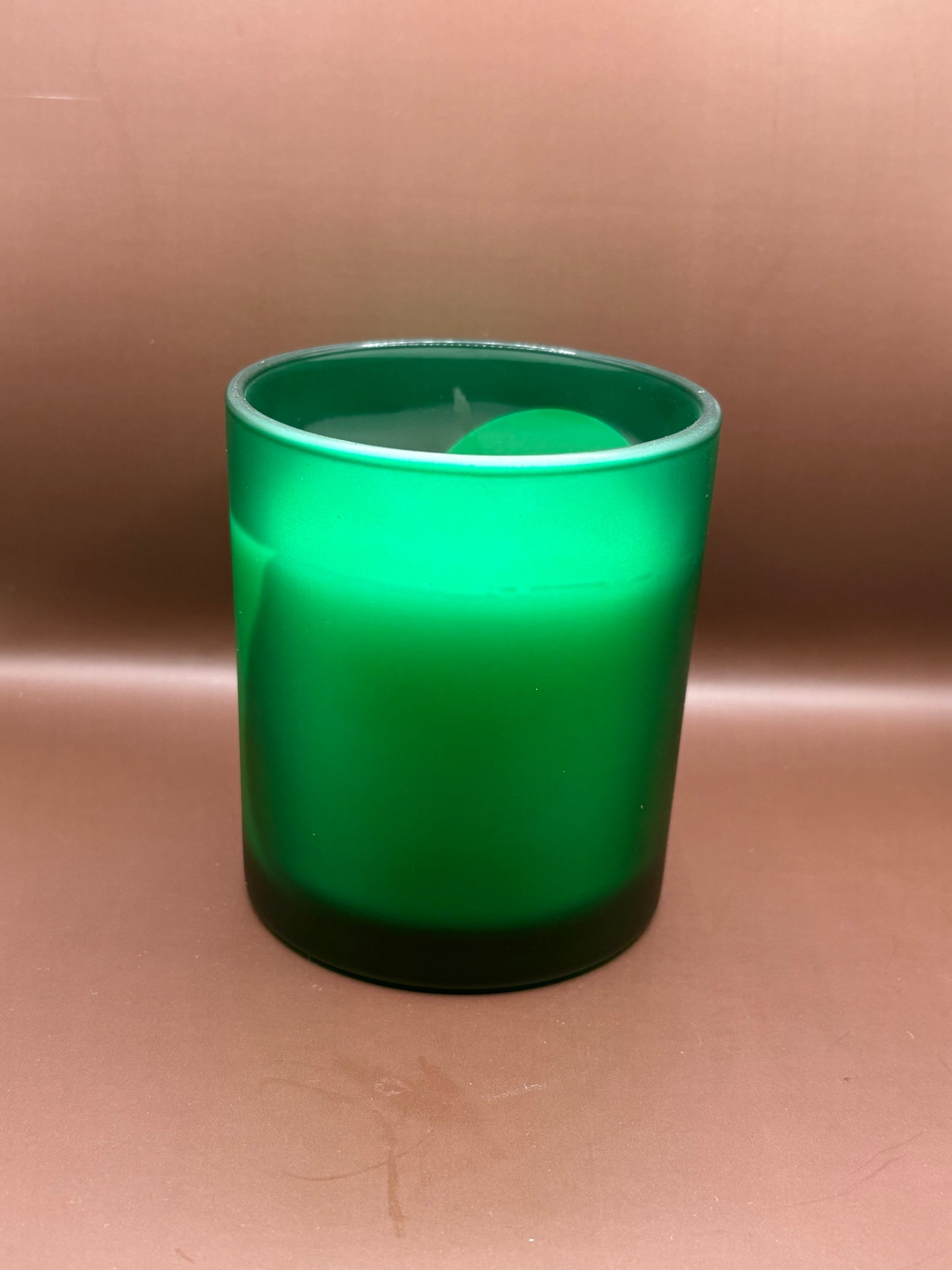Scented 7oz Soy Wax Candles In A Frosted Green Glass Candle Jar.