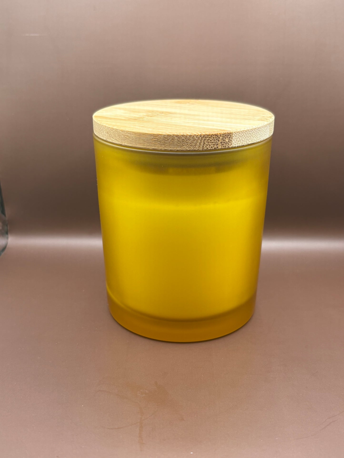 Scented 7oz Soy Wax Candles In A Frosted Yellow Glass Candle Jar.