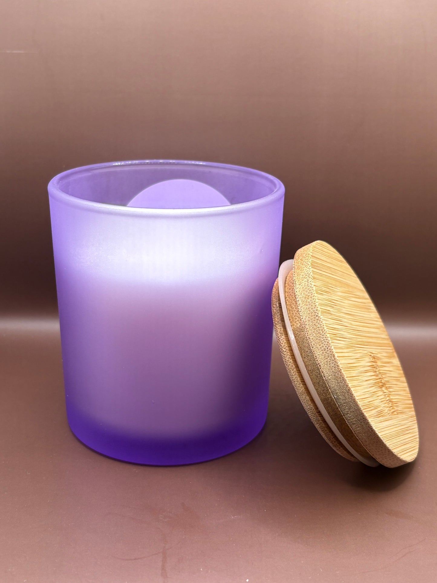 Scented 7oz Soy Wax Candles In A Frosted Purple Glass Candle Jar.